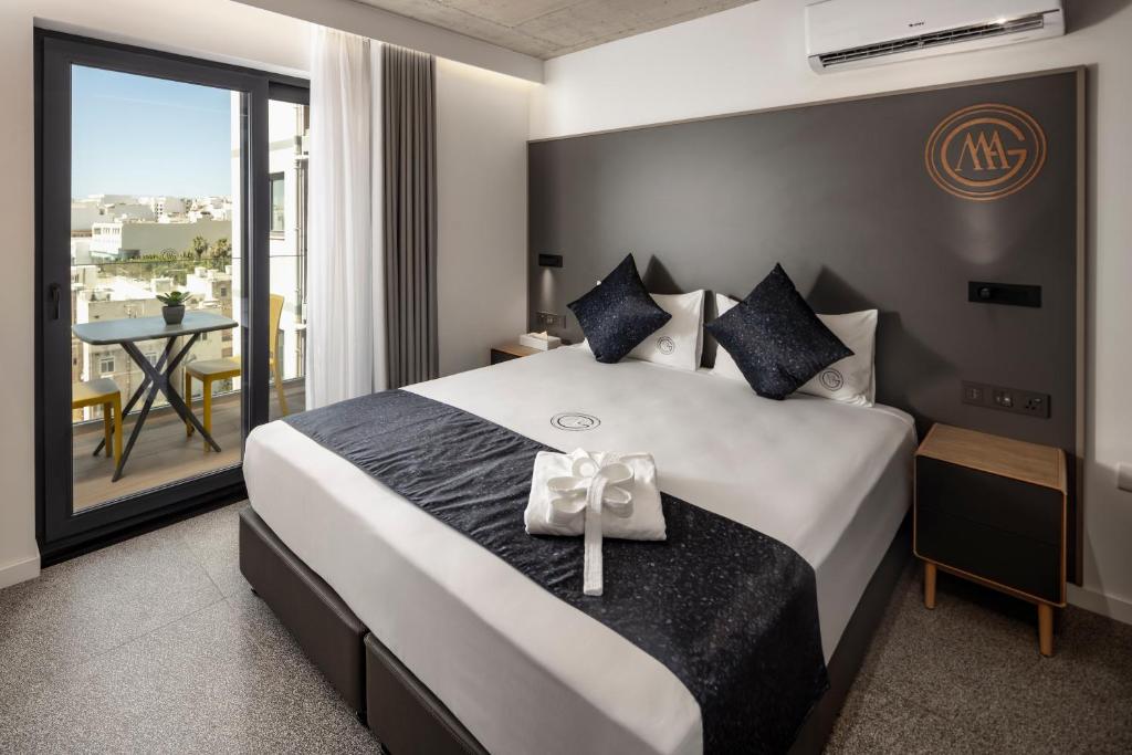 Postel nebo postele na pokoji v ubytování Grands Suites Hotel Residences and Spa