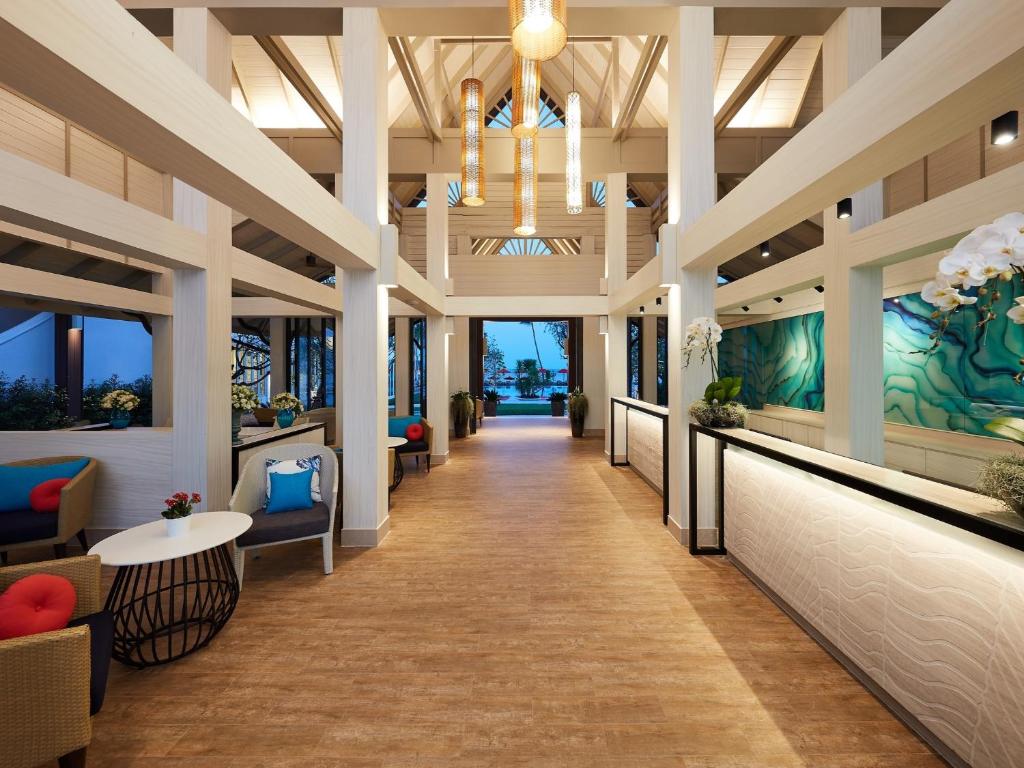 a hallway of a hotel lobby with a chandelier at Amari Koh Samui in Chaweng