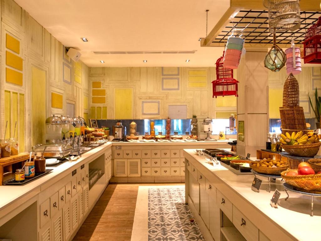 a large kitchen with alot of food on the counters at Amari Koh Samui in Chaweng
