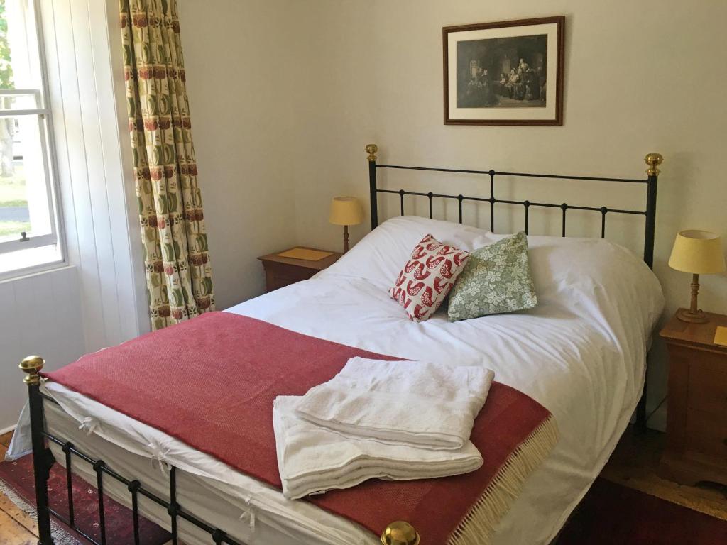 Postel nebo postele na pokoji v ubytování Rutherford House