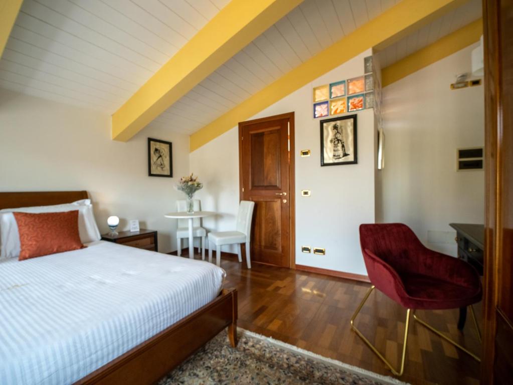 A bed or beds in a room at Ego' Residence Ferrara