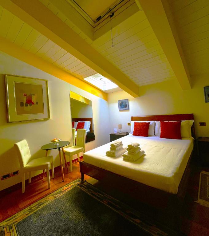 A bed or beds in a room at Ego' Residence Ferrara