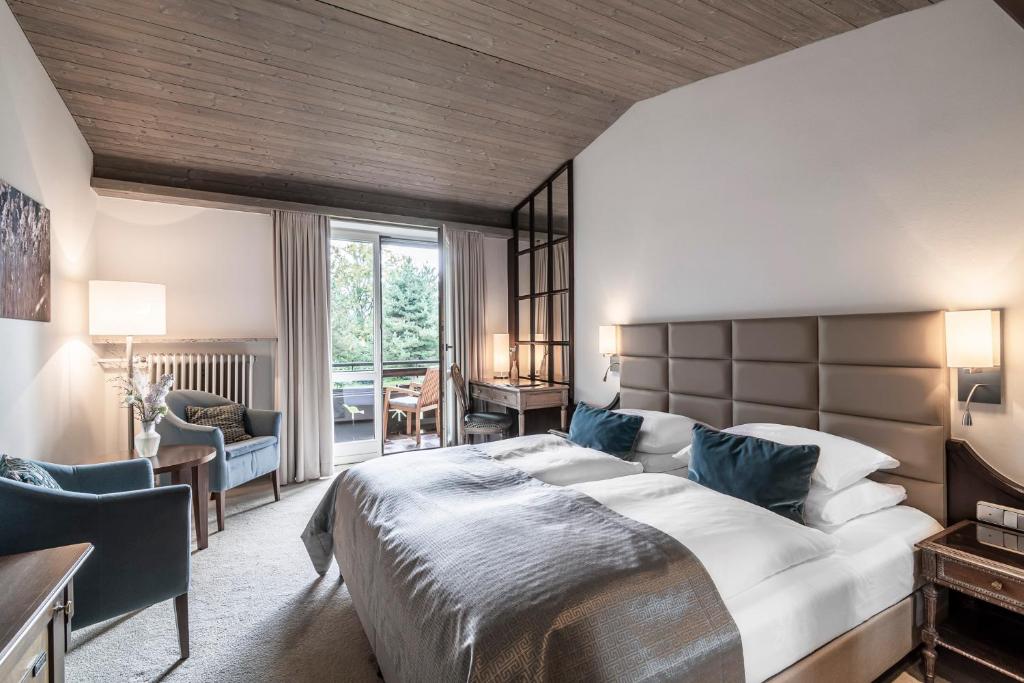 Postel nebo postele na pokoji v ubytování Alpenhof Murnau