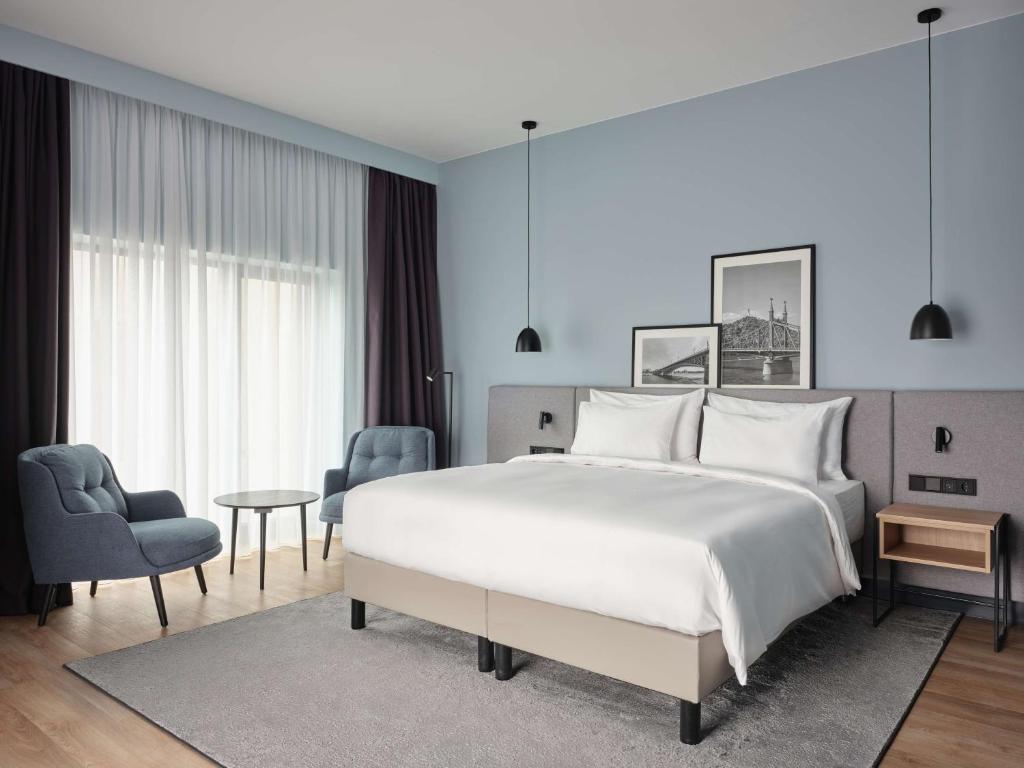 Postel nebo postele na pokoji v ubytování Radisson Hotel Budapest BudaPart