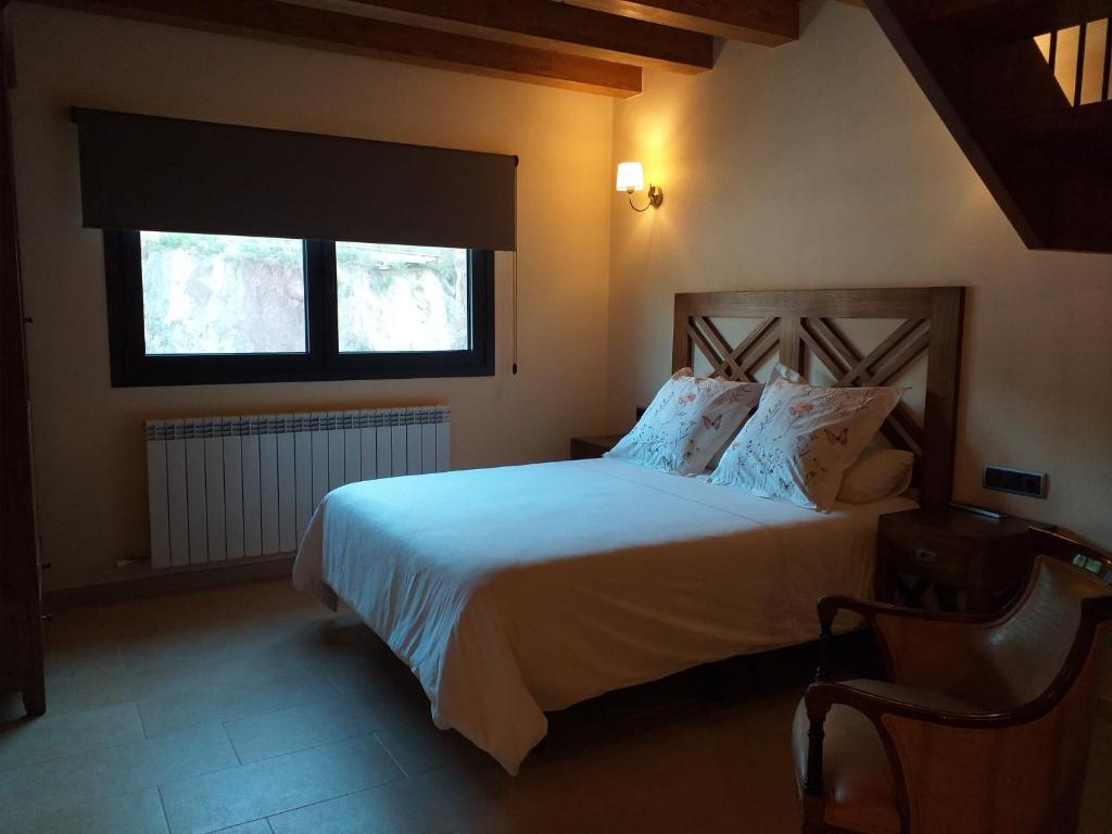 Postel nebo postele na pokoji v ubytování Les Flors - Hotel Rural & Cabanyes