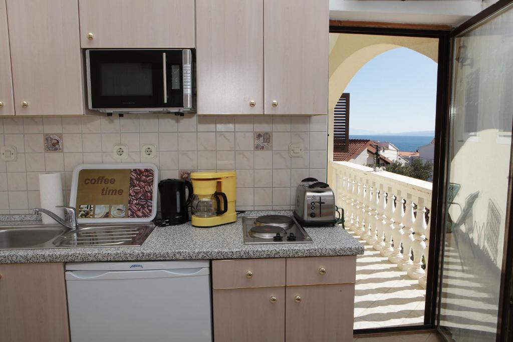 Kuchyňa alebo kuchynka v ubytovaní Apartments Villa Macola