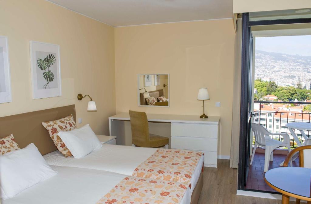 Postel nebo postele na pokoji v ubytování Dorisol Mimosa Studio Hotel