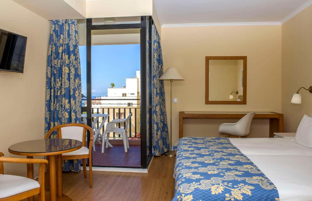 Postel nebo postele na pokoji v ubytování Dorisol Mimosa Studio Hotel