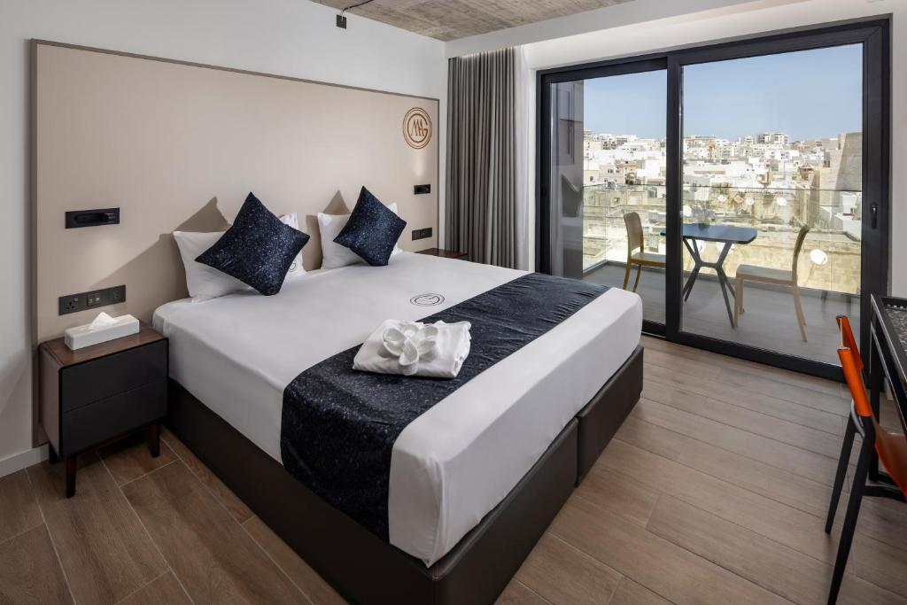 Postel nebo postele na pokoji v ubytování Grands Suites Hotel Residences and Spa