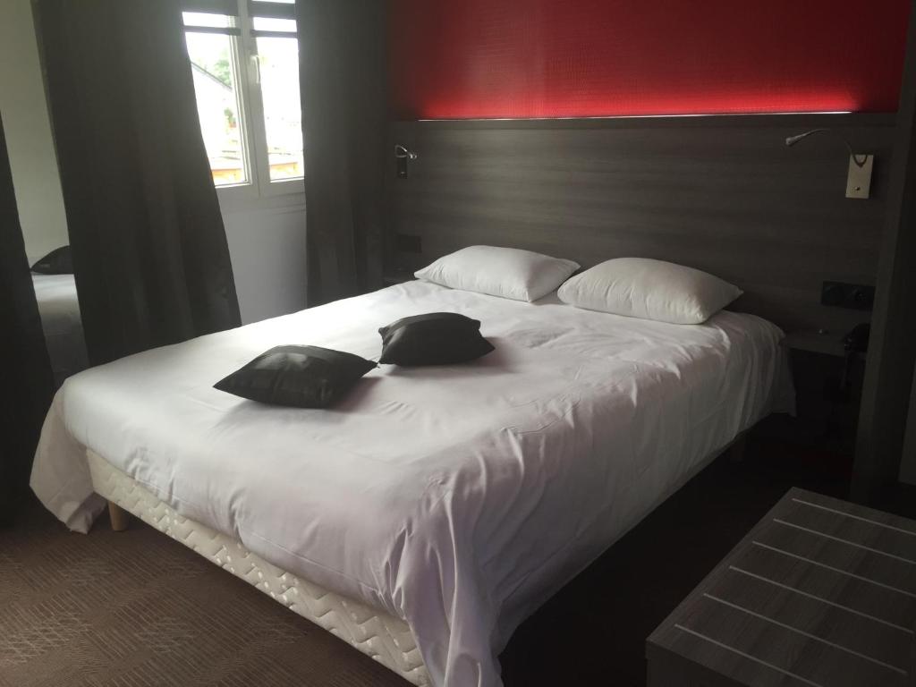 Postel nebo postele na pokoji v ubytování Le Beverl'inn