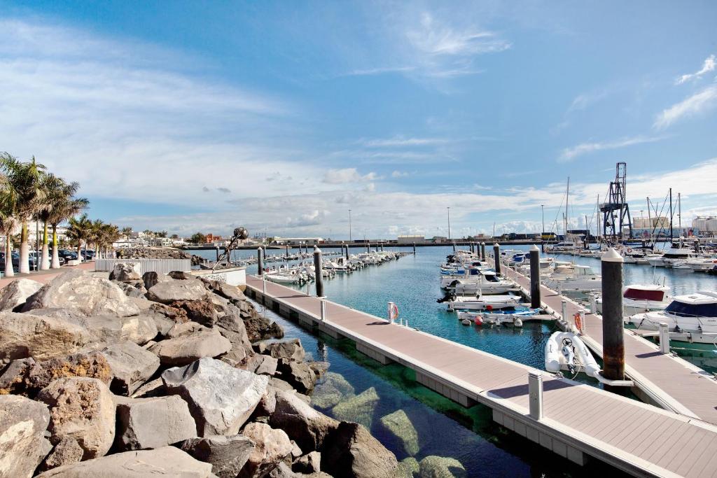 a marina with boats docked in the water at Casa Barranco de la Sal in Puerto del Rosario