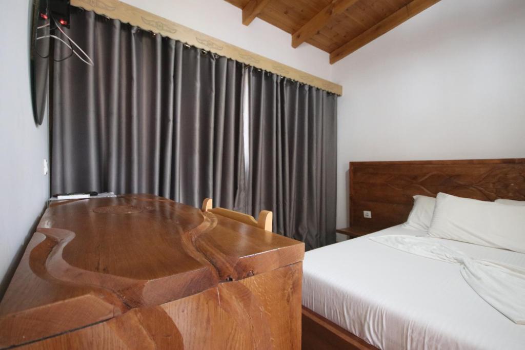 Säng eller sängar i ett rum på Vila Mateus