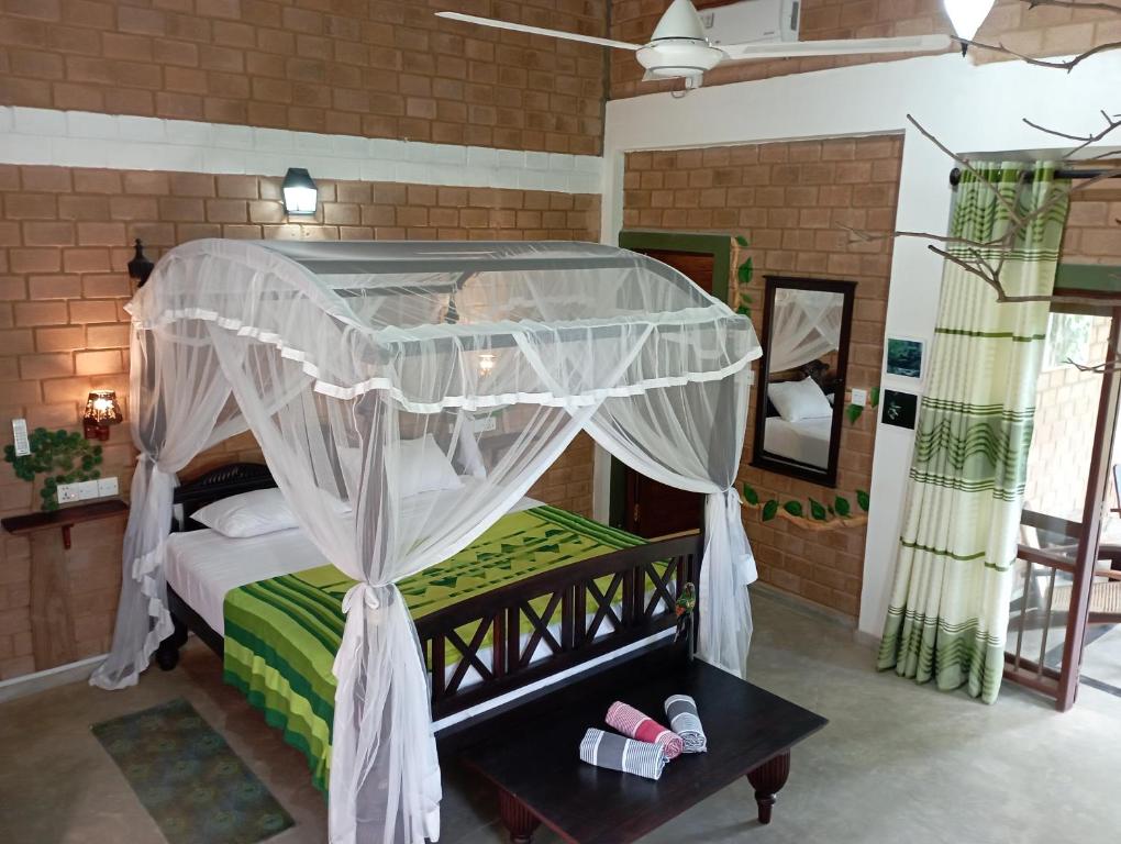 Postel nebo postele na pokoji v ubytování Villa Lyvie ayurvedic hotel