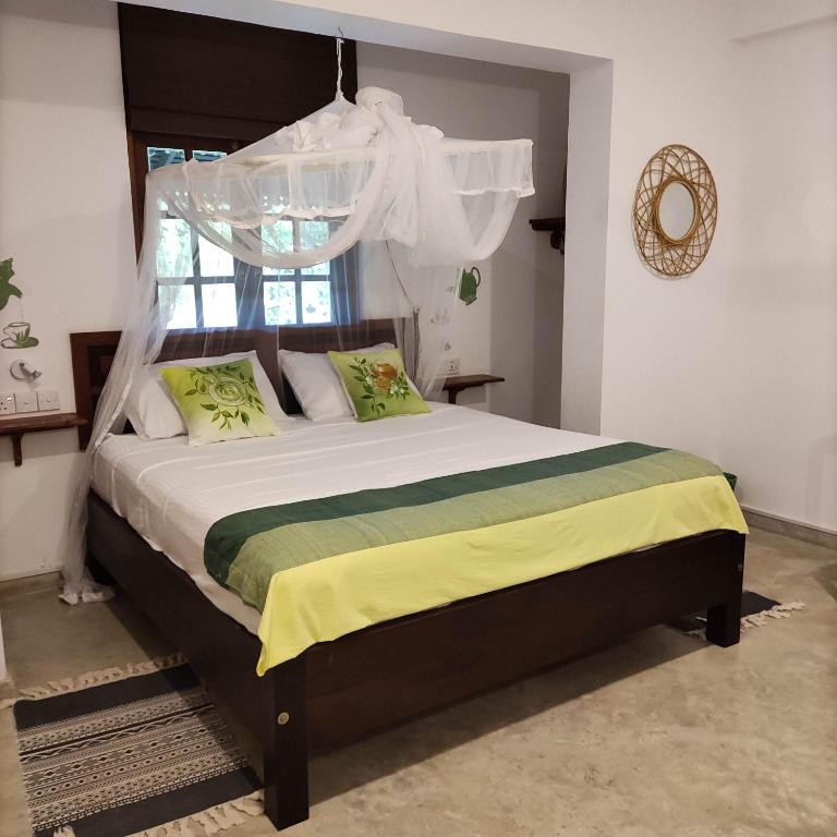Postel nebo postele na pokoji v ubytování Villa Lyvie ayurvedic hotel
