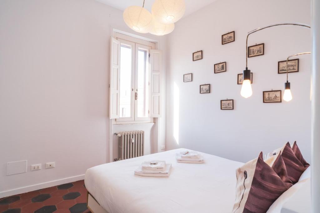 Posteľ alebo postele v izbe v ubytovaní HC - Sunny Apartment in Testaccio!