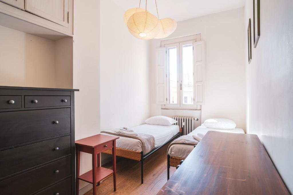 Posteľ alebo postele v izbe v ubytovaní HC - Sunny Apartment in Testaccio!