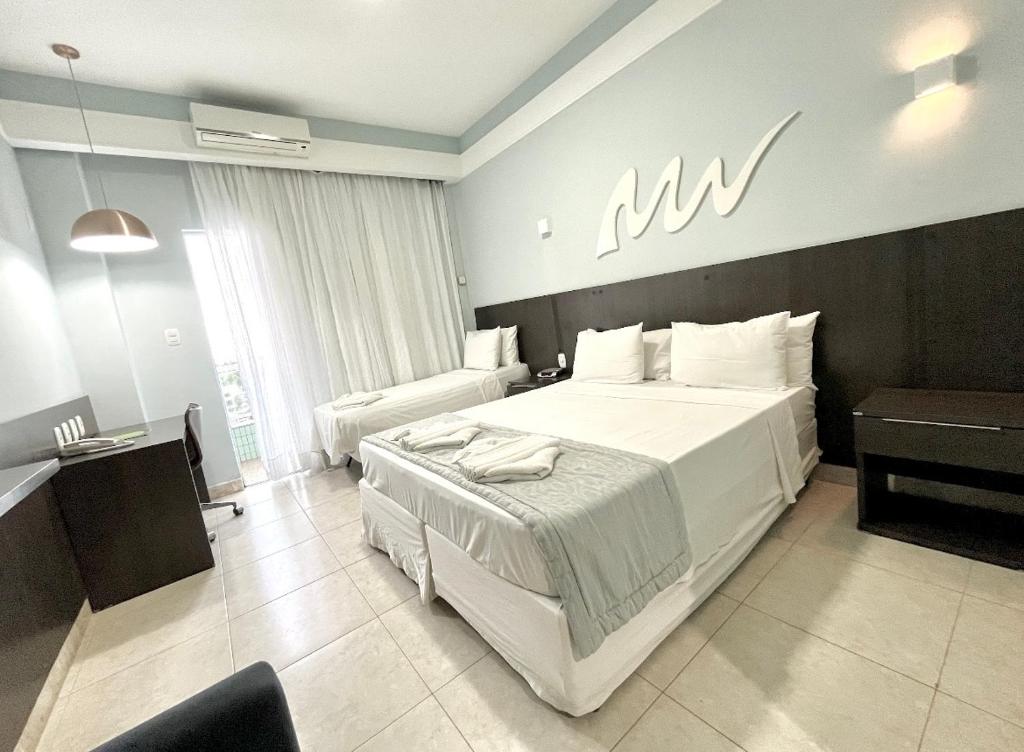 Postel nebo postele na pokoji v ubytování Real Classic Hotel