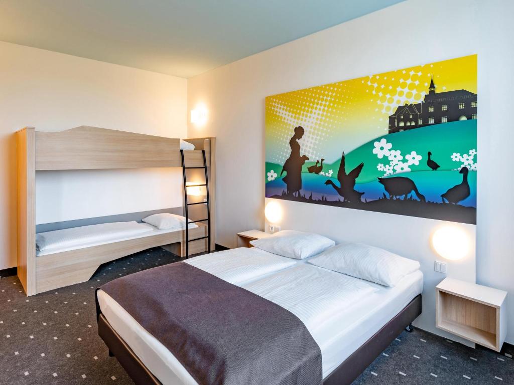 Postel nebo postele na pokoji v ubytování B&B Hotel Göttingen-City