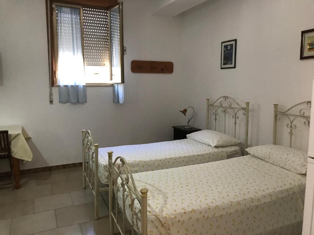 Postel nebo postele na pokoji v ubytování Albergo Europa