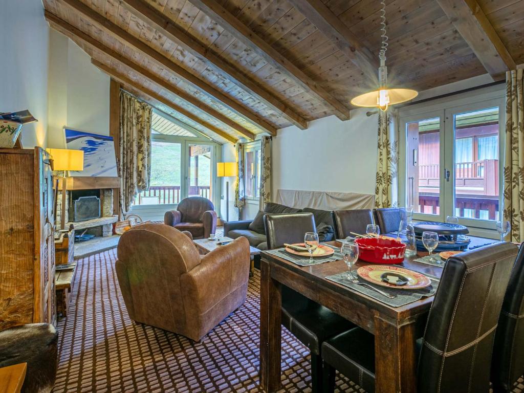 a living room with a table and chairs at Appartement Val-d'Isère, 3 pièces, 5 personnes - FR-1-694-216 in Val-d'Isère