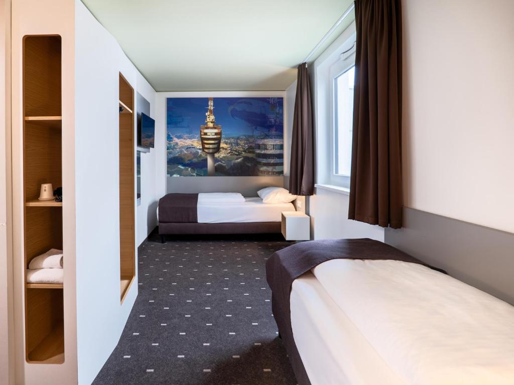 Postel nebo postele na pokoji v ubytování B&B Hotel Stuttgart-Airport/Messe