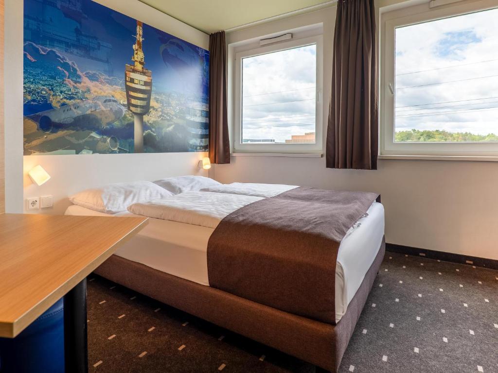 Postel nebo postele na pokoji v ubytování B&B Hotel Stuttgart-Airport/Messe