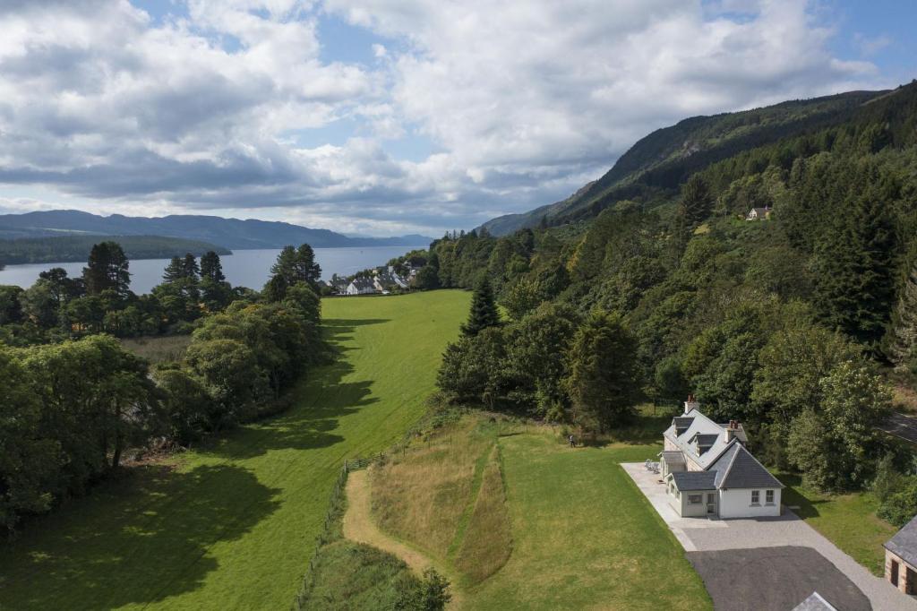 an aerial view of a house on a green field at Middleton Farmhouse in Inverness