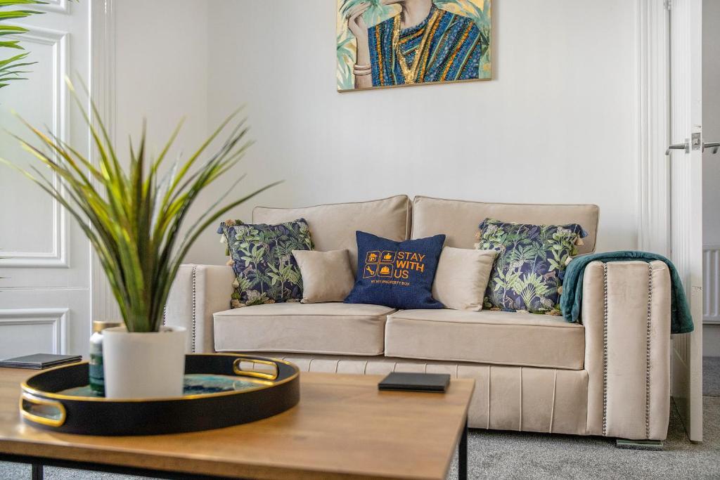 a living room with a couch and a coffee table at Spacious & Modern Oasis, 4-Bed House, Sleeps 7 in Sunderland