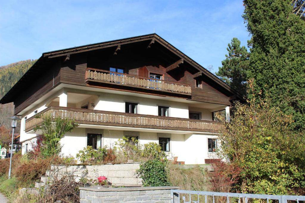 a house with a balcony on top of it at Amadee Appartements in Bad Kleinkirchheim