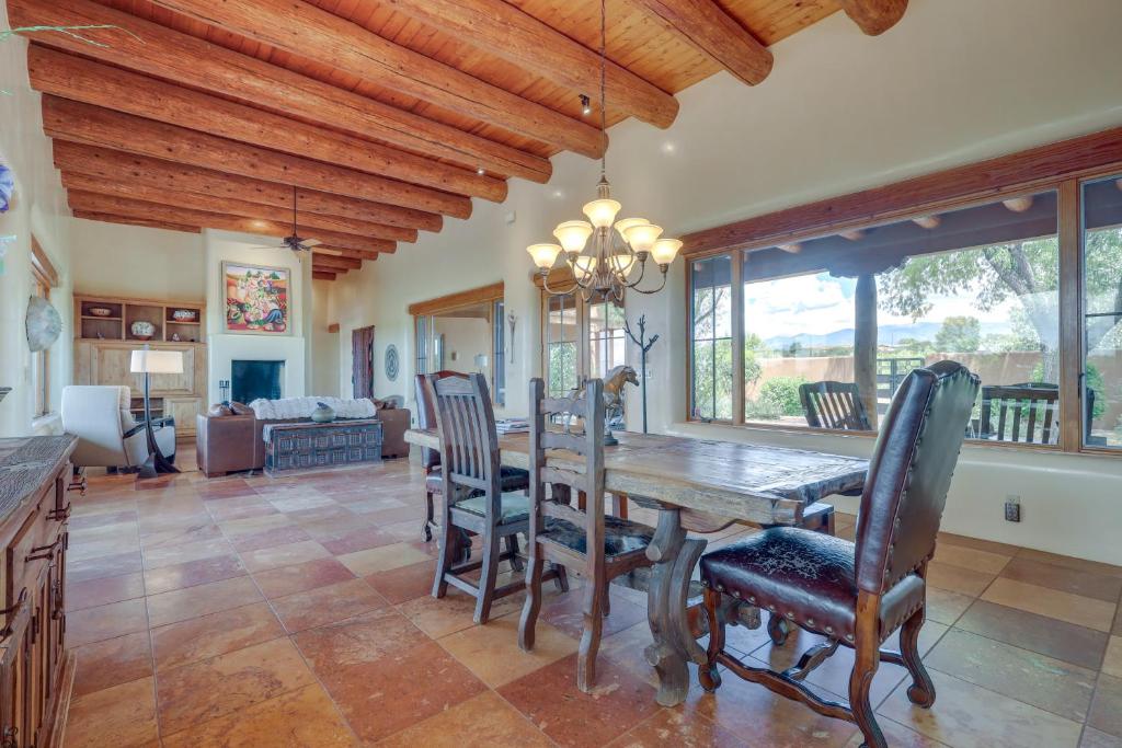 a dining room with a wooden table and chairs at Spacious Santa Fe Vacation Rental about 5 Mi to Town! in Santa Fe