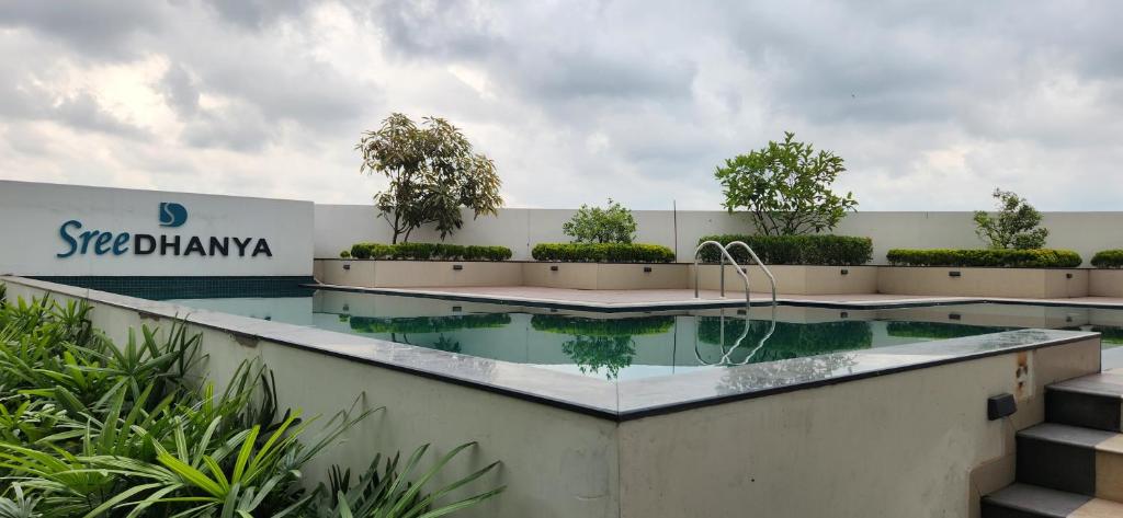 a swimming pool on the side of a building at 1BHK LUXURY APARTMENT- Palayam in Trivandrum