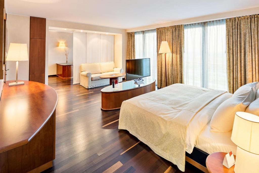 Ένα ή περισσότερα κρεβάτια σε δωμάτιο στο Austria Trend Hotel Ljubljana