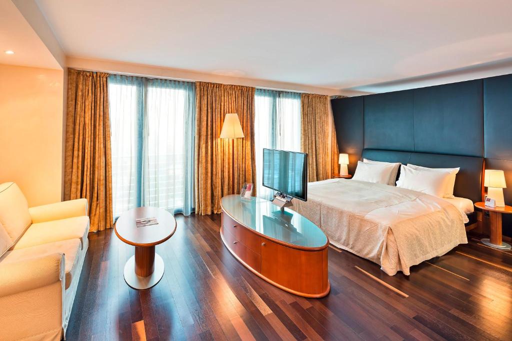 Ένα ή περισσότερα κρεβάτια σε δωμάτιο στο Austria Trend Hotel Ljubljana