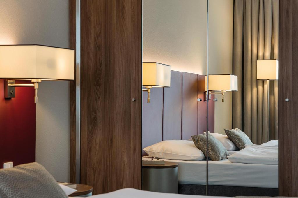 Postel nebo postele na pokoji v ubytování Austria Trend Hotel Europa Salzburg