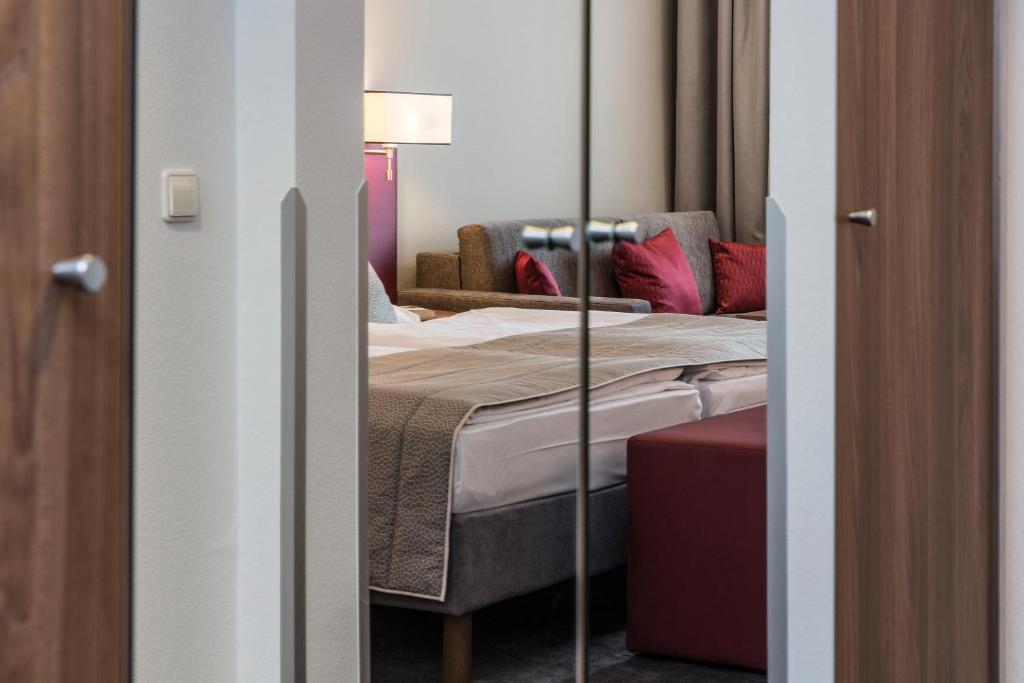 Postel nebo postele na pokoji v ubytování Austria Trend Hotel Europa Salzburg