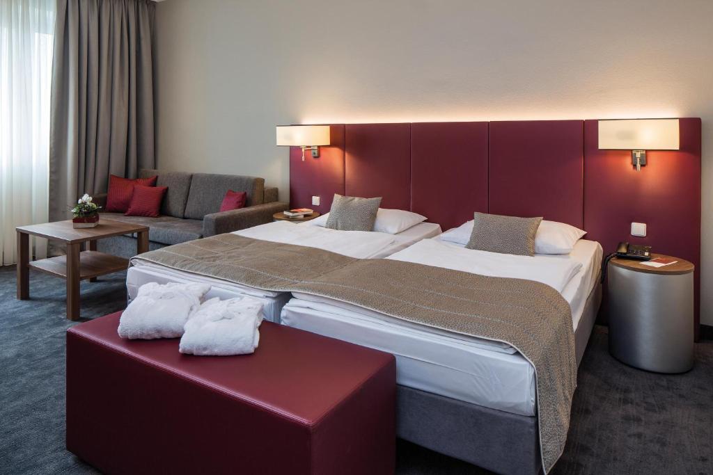 Postel nebo postele na pokoji v ubytování Austria Trend Hotel Europa Salzburg