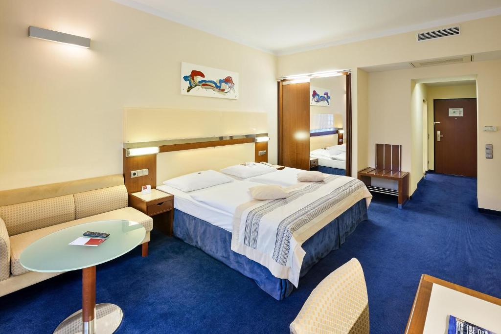 Postel nebo postele na pokoji v ubytování Austria Trend Hotel Europa Wien