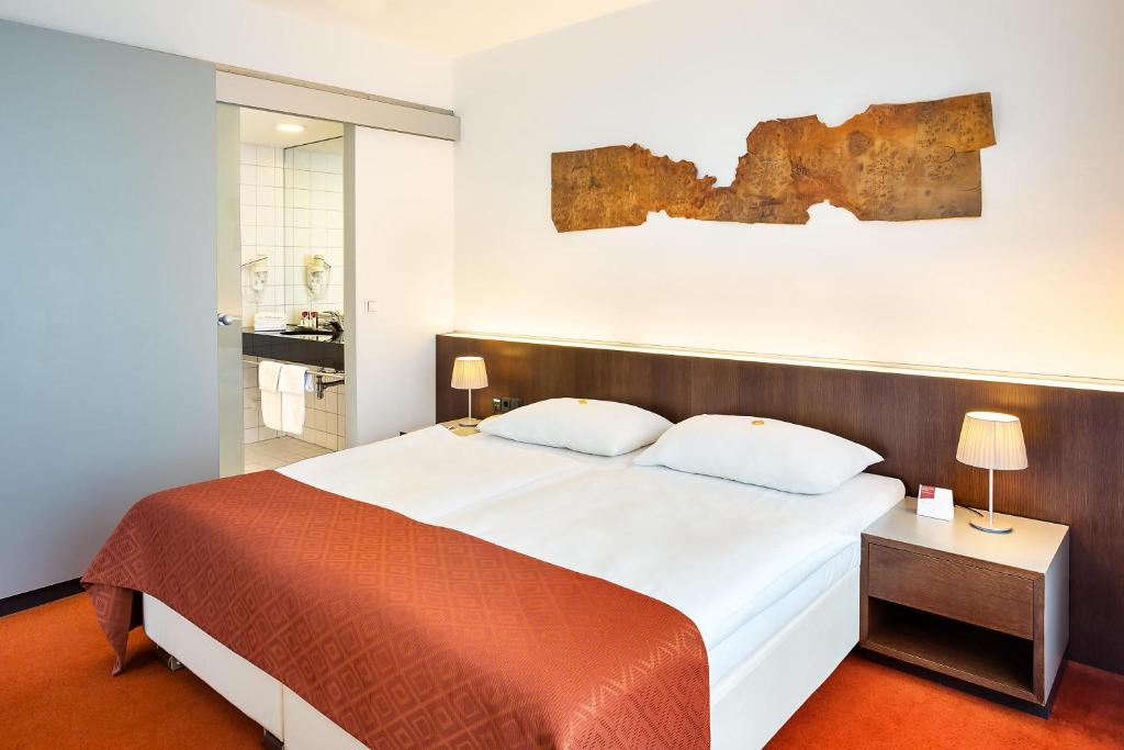 Postel nebo postele na pokoji v ubytování Austria Trend Hotel Europa Wien