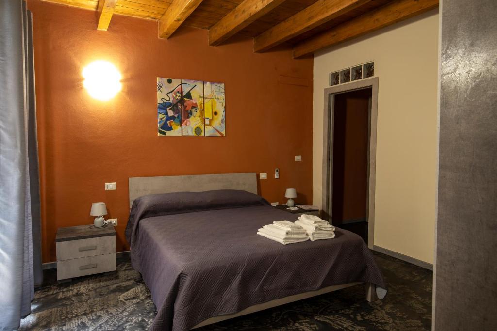 Postel nebo postele na pokoji v ubytování Via Cavour 19, Camere del Conte