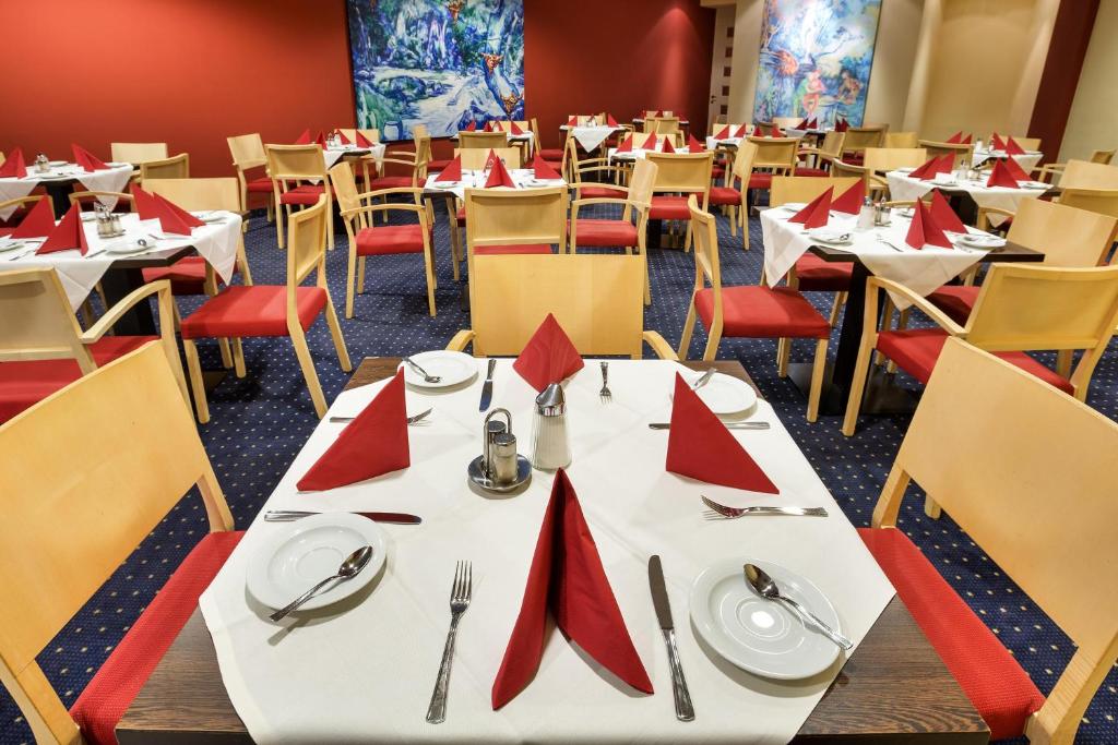 Un restaurant u otro lugar para comer en Austria Trend Hotel Ananas Wien