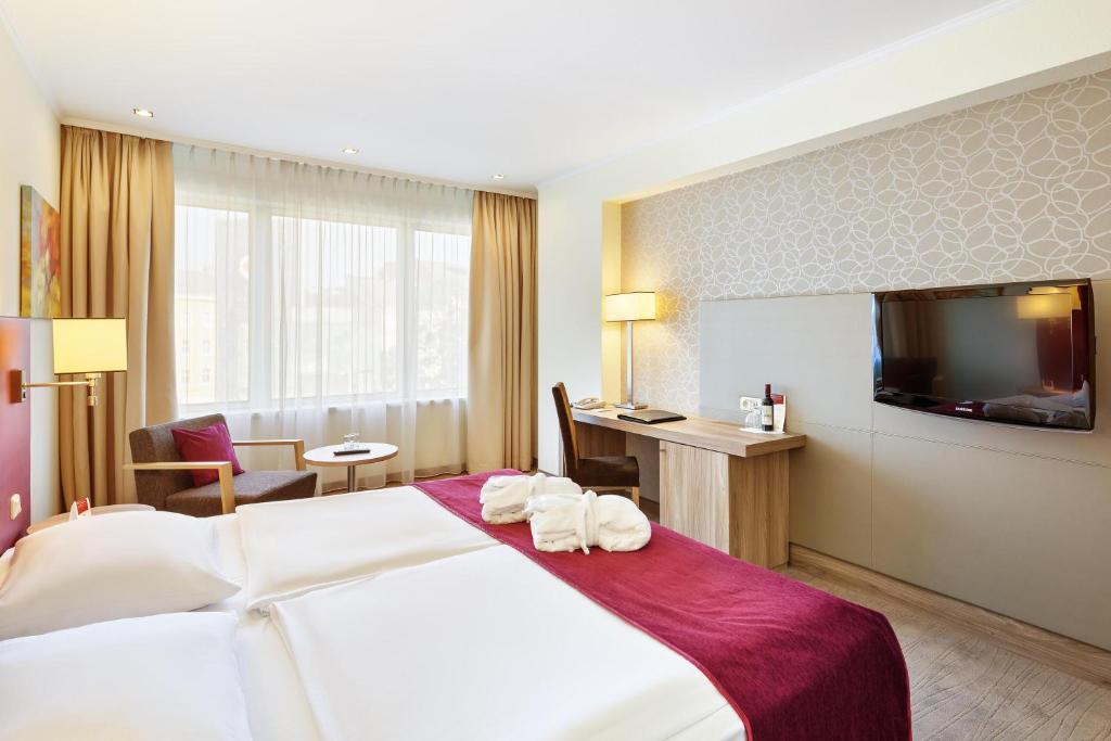 TV a/nebo společenská místnost v ubytování Hotel Schillerpark Linz, a member of Radisson Individuals