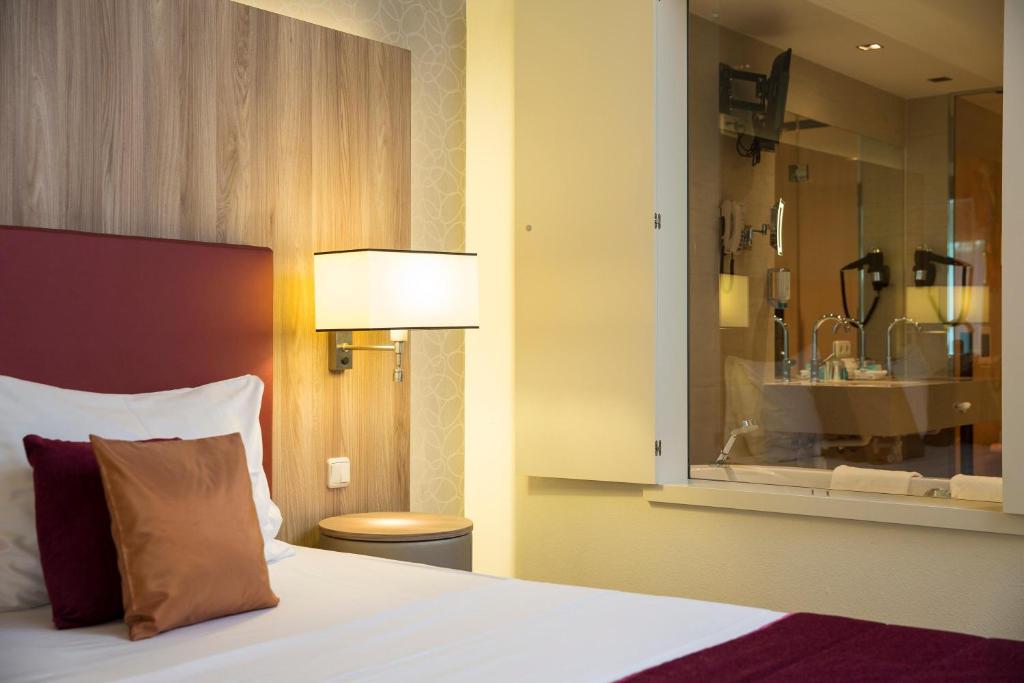 Postel nebo postele na pokoji v ubytování Hotel Schillerpark Linz, a member of Radisson Individuals