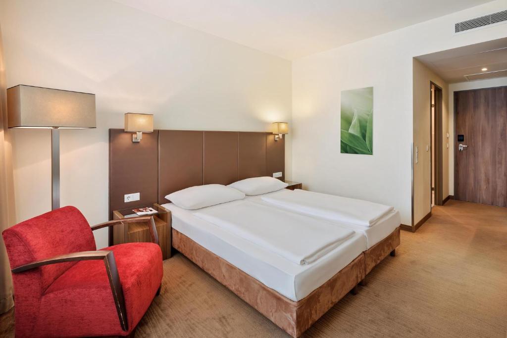 Postel nebo postele na pokoji v ubytování Austria Trend Hotel Doppio Wien