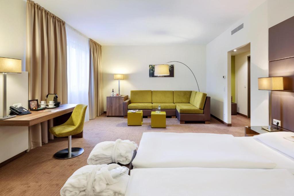 Postel nebo postele na pokoji v ubytování Austria Trend Hotel Doppio Wien