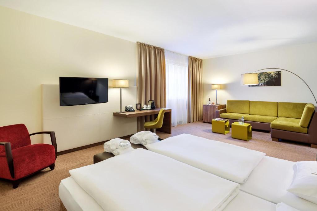 Postel nebo postele na pokoji v ubytování Austria Trend Hotel Doppio Wien