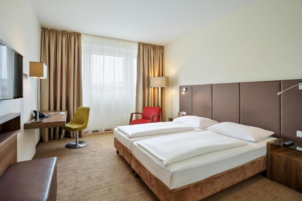 Postel nebo postele na pokoji v ubytování Austria Trend Hotel Doppio Wien