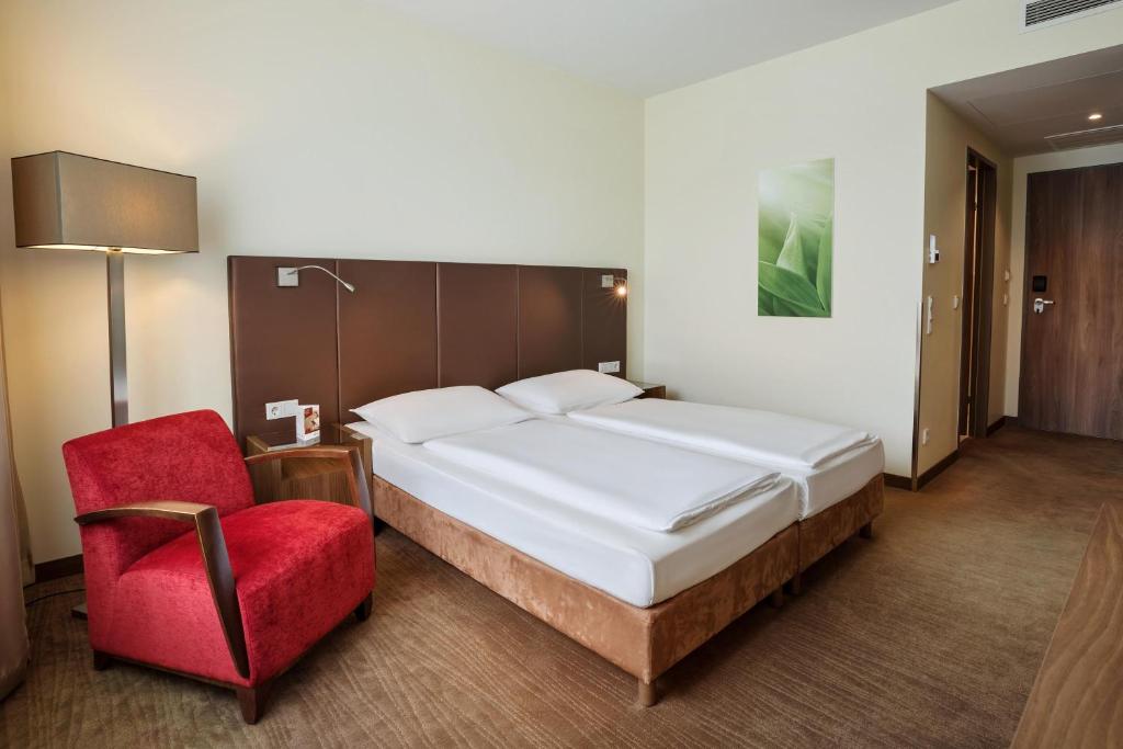 Postel nebo postele na pokoji v ubytování Austria Trend Hotel Doppio Wien