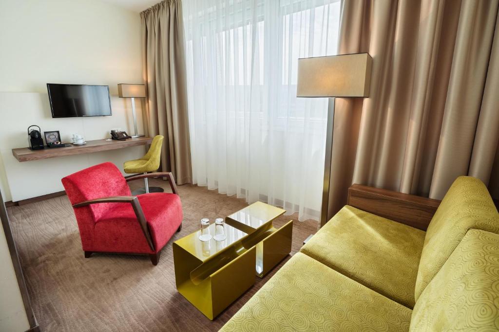 TV a/nebo společenská místnost v ubytování Austria Trend Hotel Doppio Wien