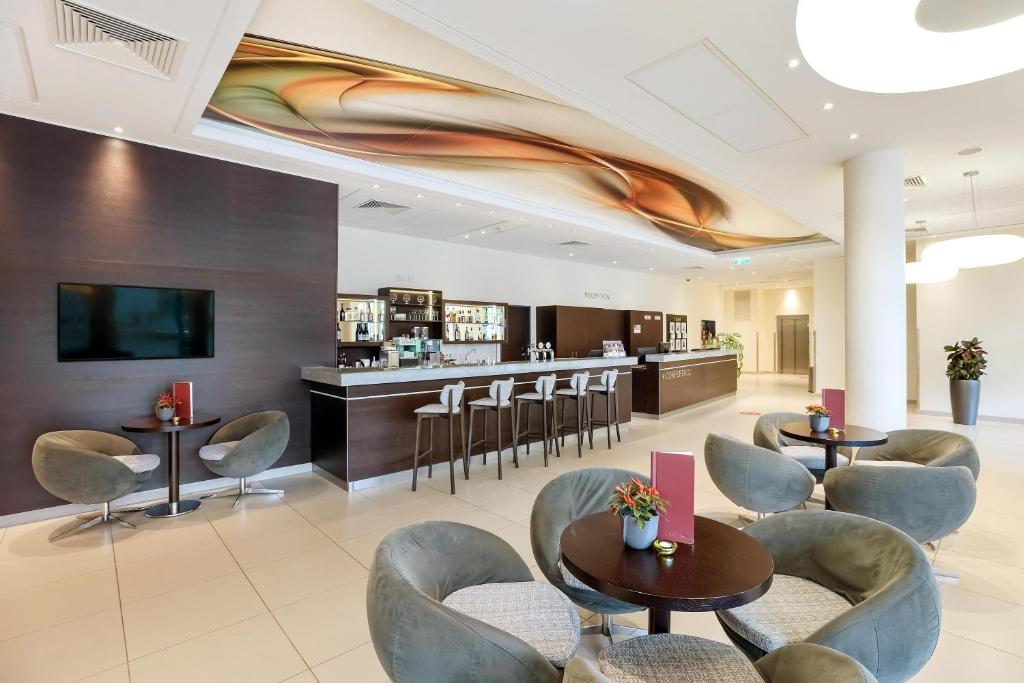 TV a/nebo společenská místnost v ubytování Austria Trend Hotel Doppio Wien