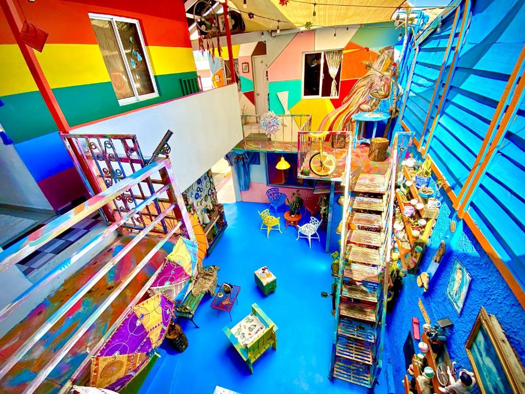 an overhead view of a play room with a water slide at La Fuente House Art Space in Constanza